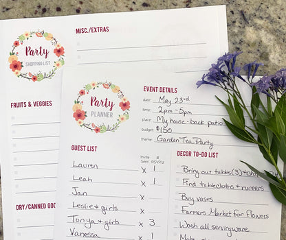 Party Planning Pages in use with Event Details and Shopping List pages shown. The event deatils are filled out in pen with details for a garden tea party